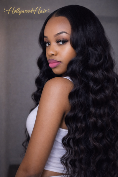 Model wearing Loose Wave human hair bundles in a flowy  soft wavy install