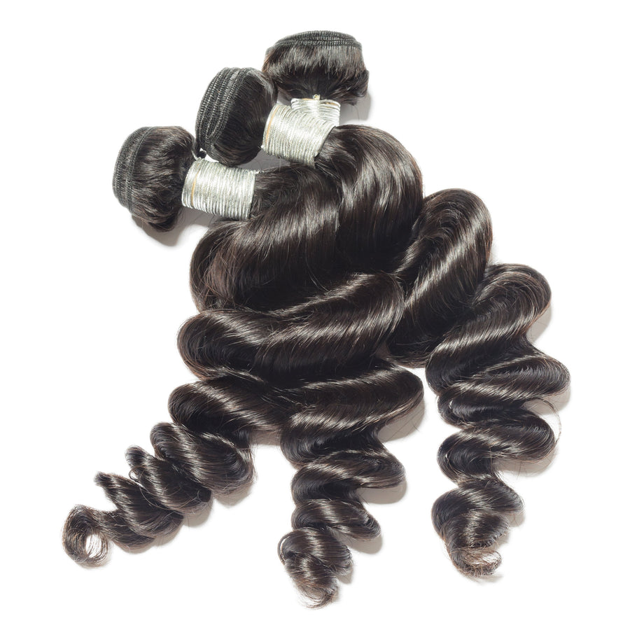 Three Lola Loose Wave human hair bundles with soft flowing texture