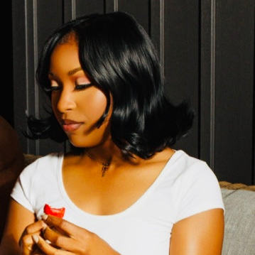 Model wearing black Silky straight bundles With soft flips in a Middle part BOB install