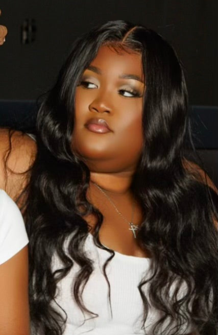 A close-up Picture of a model Wearing a platinum collection Baddie body wave Install