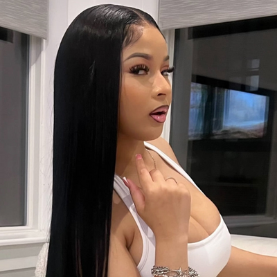 Model wearing Black Silky
 starlet straight  bundles with a buss down middle part install